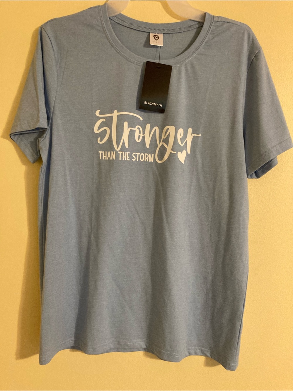 'Stronger Than The Storm' Light Blue Graphic Tee
